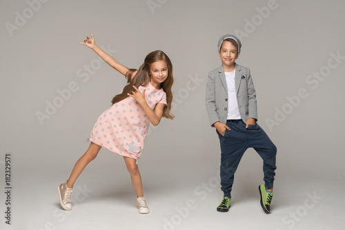 Happy dancing kids. Studio photo.