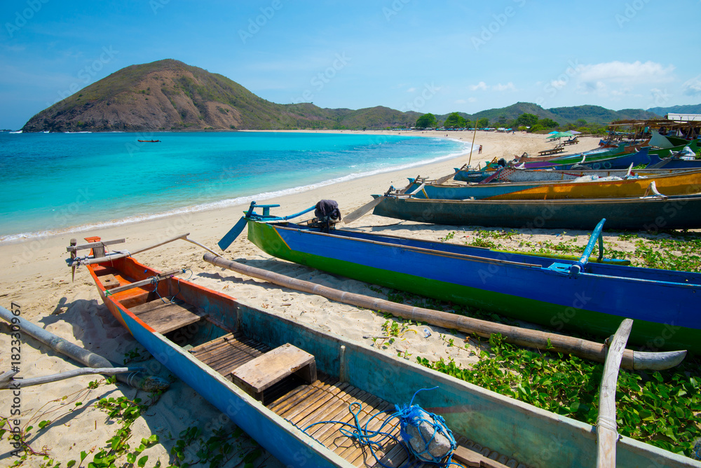 Fishing boats on Mawun beach - Lombok, Indonesia.