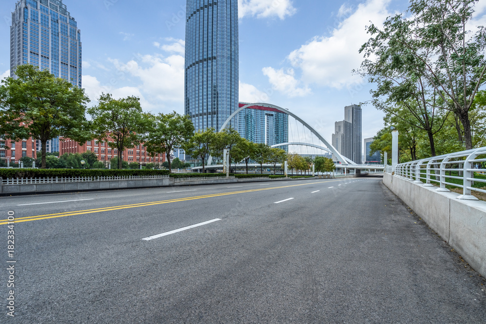 city road through modern buildings in Tianjin