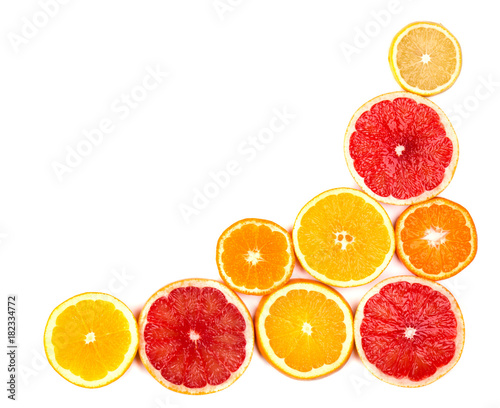 Isolated citrus fruits. Pieces of lemon  lime  pink grapefruit and orange isolated on white background  with clipping path. Top view