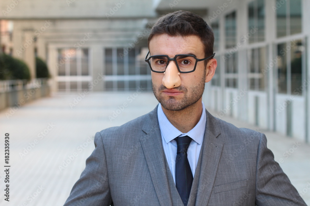 Businessman wearing fake nose-glasses combo Businessman wearing fake nose-glasses combo