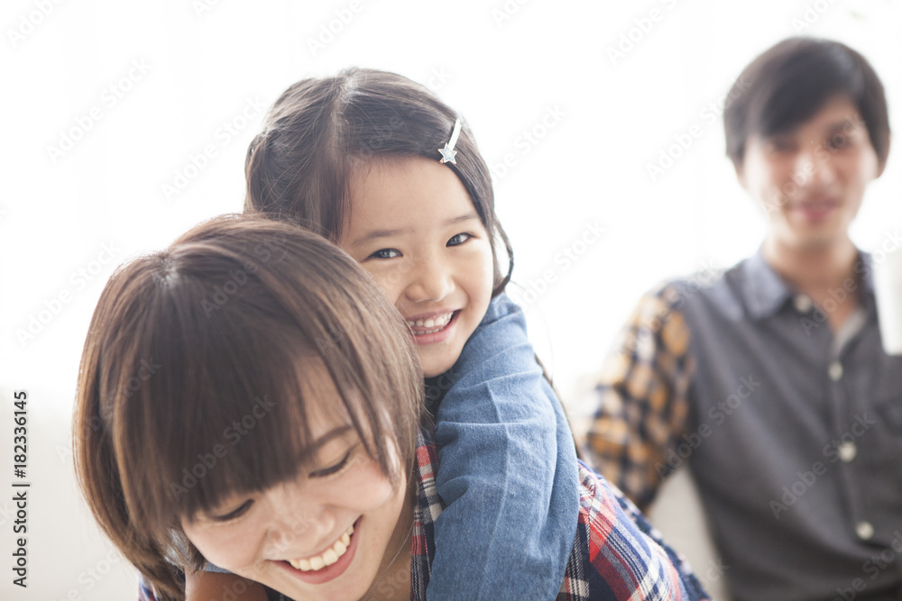 Parents and daughter are sitting on the sofa and talking. Parents and daughter are sitting on the sofa and talking.