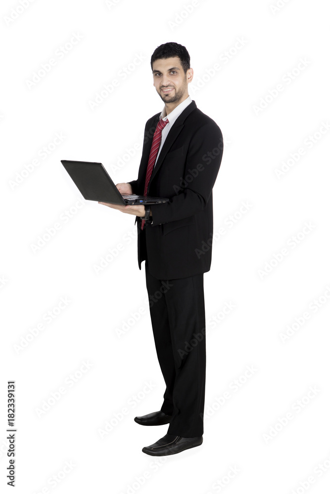 Italian businessman using a laptop on studio Italian businessman using a laptop on studio
