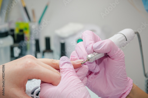 Wallpaper Mural To cut nails the machine. Processing of nails the machine in beauty shop. Torontodigital.ca