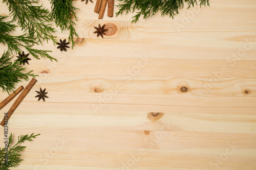 Christmas background. Top view mockup  branches fir tree on wooden desk.