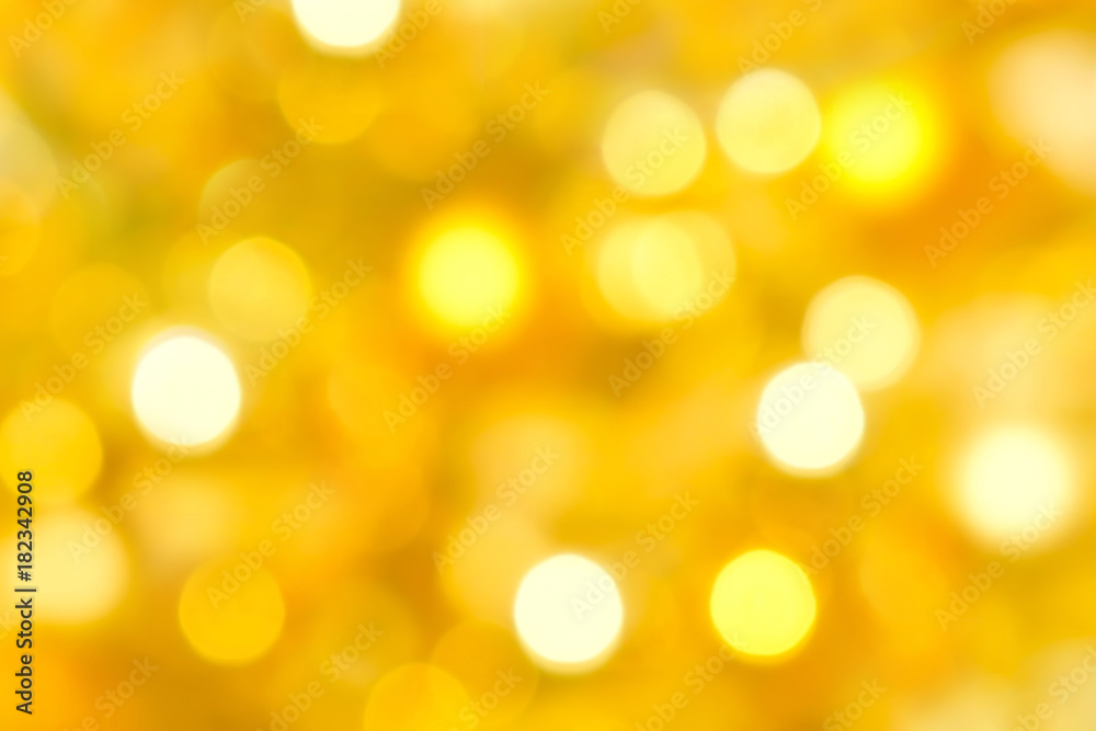 Obraz premium Abstract bokeh light gold background