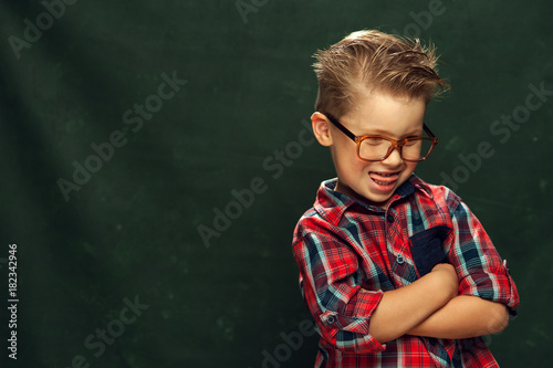 Cute funny boy with glasses and stylish shirt