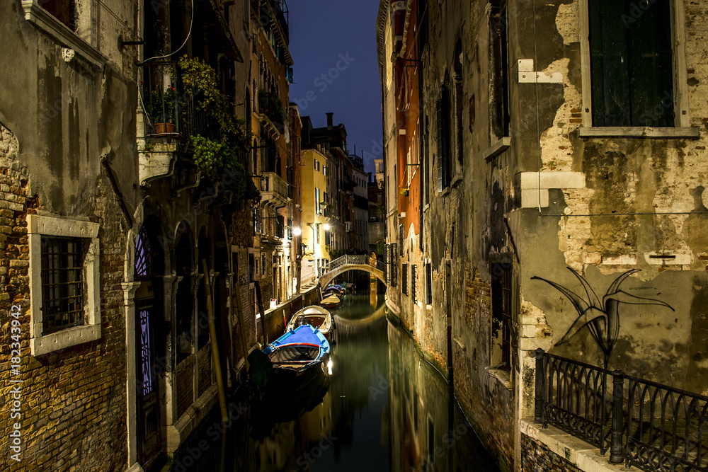 Canal alley with boats and gondola romantic Venice
