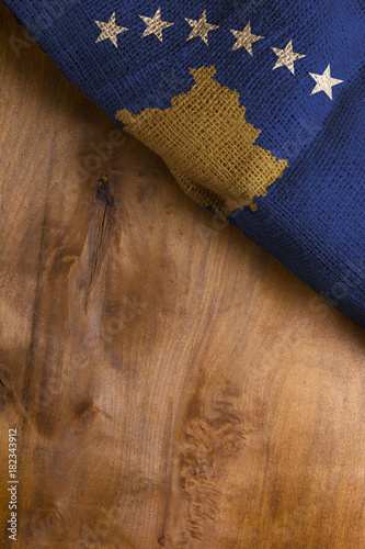 Flag of Kosovo on wooden background