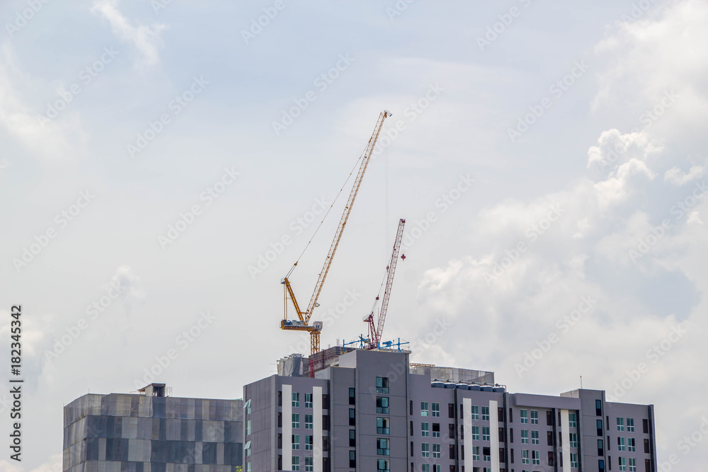 cranes working on under construction building