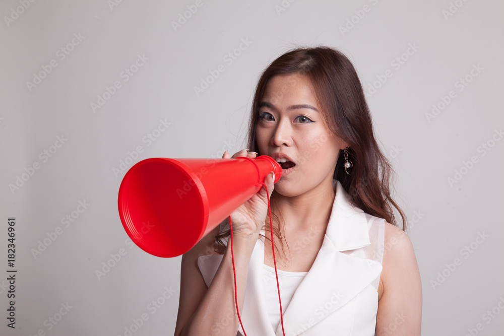Beautiful young Asian woman announce with megaphone. Beautiful young Asian woman announce with megaphone.