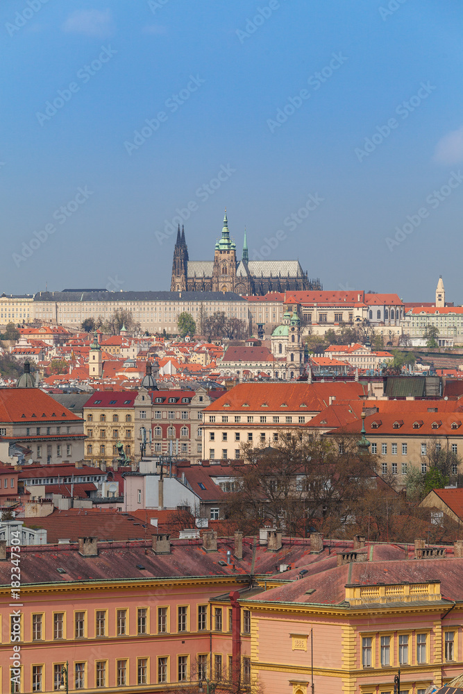 Prague rooftops. Beautiful aerial view of Czech baroque architecture and St. Vitus Cathedral.