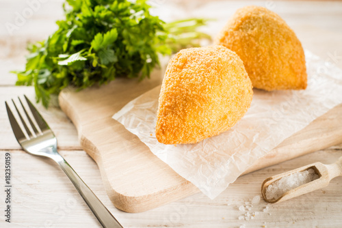 Chicken Kiev cutlets with parsley leaves and butter photo