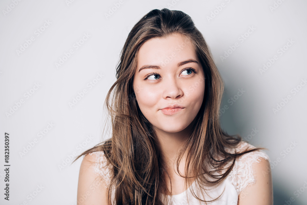 Beautiful woman looking aside to realize tricky plan, sly expression while looking aside. Beautiful woman looking aside to realize tricky plan, sly expression while looking aside.