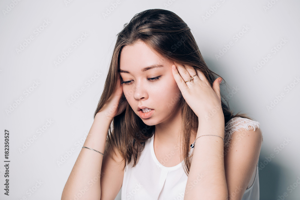 Young annoyed woman sticking fingers in ears with eyes closed, not listening to loud noise, ignoring stressful environment, stubborn teen refuses hearing, feels ear ache, tinnitus, head shot portrait Young annoyed woman sticking fingers in ears with eyes closed, not listening to loud noise, ignoring stressful environment, stubborn teen refuses hearing, feels ear ache, tinnitus, head shot portrait