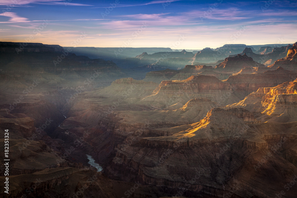 Sunlight shining into the Grand Canyon at Lipan Point at sunset