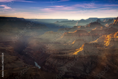 Sunlight shining into the Grand Canyon at Lipan Point at sunset