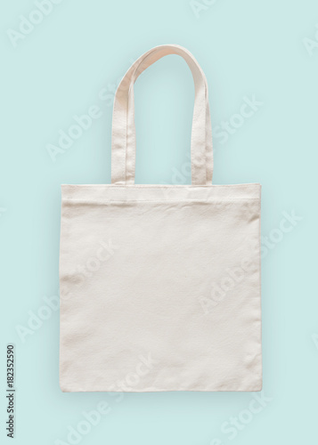 Tote bag canvas fabric cloth eco shopping sack mockup blank template isolated on pastel mint blue background (clipping path)