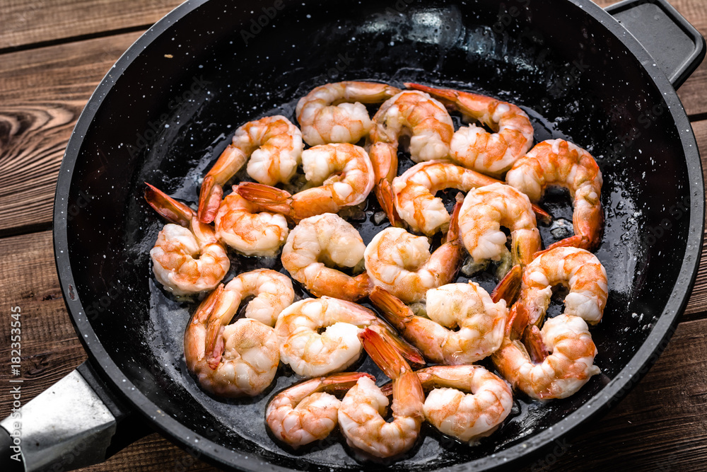 Grilled shrimp, preparation of seafood dish, mediterranean diet concept