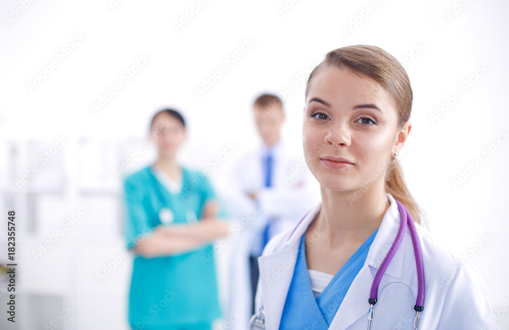 Attractive female doctor in front of medical group. Attractive female doctor in front of medical group.