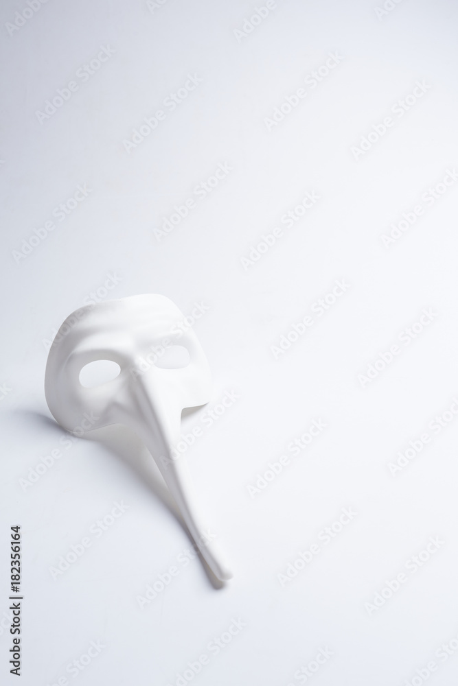 white venetian mask on a white background