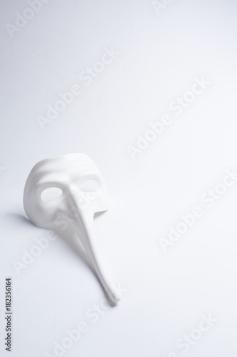 Fototapeta Naklejka Na Ścianę i Meble -  white venetian mask on a white background