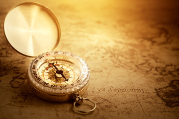 Old vintage compass on vintage map