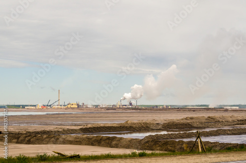 Oil refinery plant and oil sand photo
