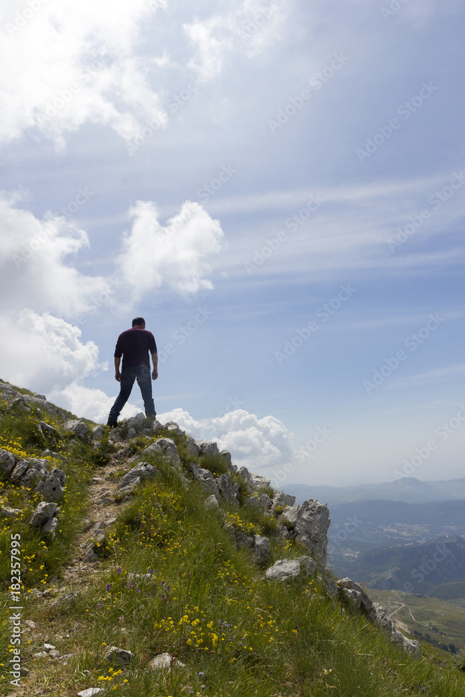 hiker on mountain trail