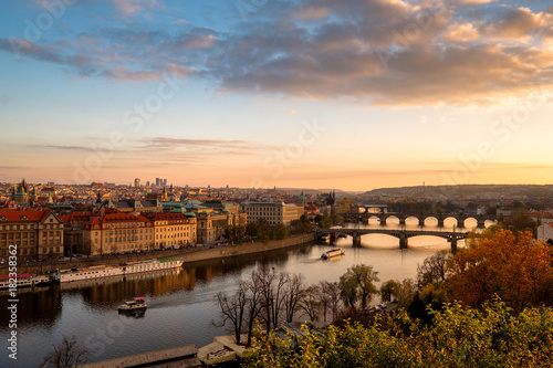Panorama of the old part of Prague from the Letna park at dusk. Beautiful view on the bridges over the river Vltava at sunset. Old Town architecture  Czech Republic.