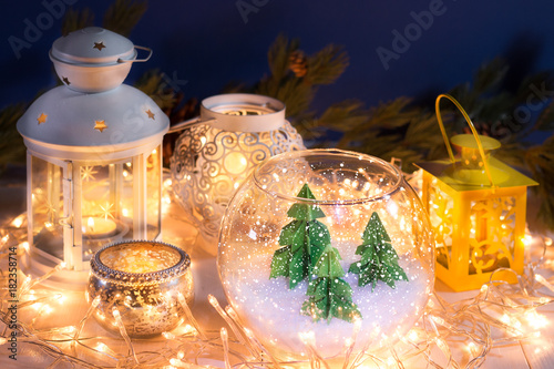 Still life pocture with Christmas lanterns and small pine trees miniature photo