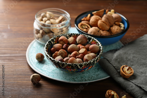 walnuts and hazelnuts in color bowl