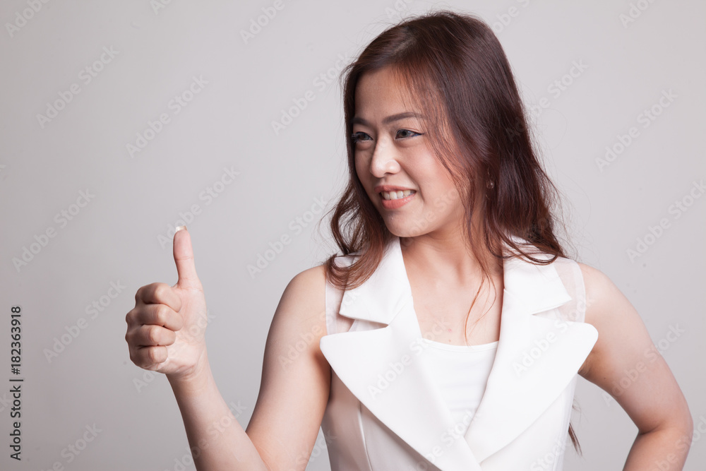 Asian woman thumbs up and smile. Asian woman thumbs up and smile.