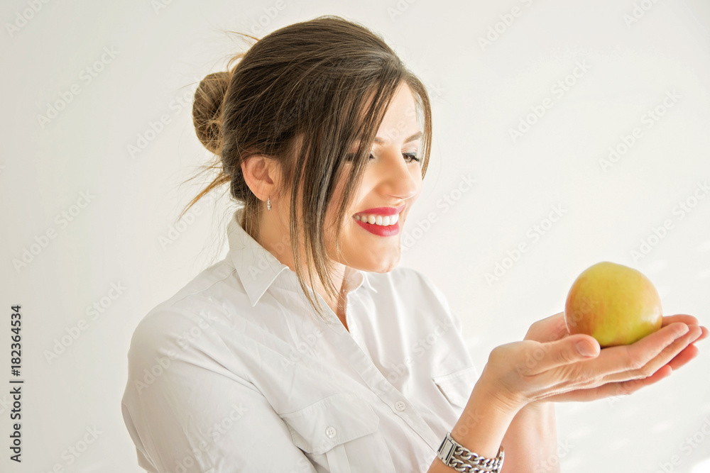 Beautiful woman with pearly white and healthy teeth eating apple Beautiful woman with pearly white and healthy teeth eating apple