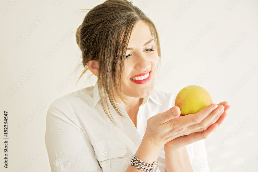 Beautiful woman with pearly white and healthy teeth eating apple Beautiful woman with pearly white and healthy teeth eating apple