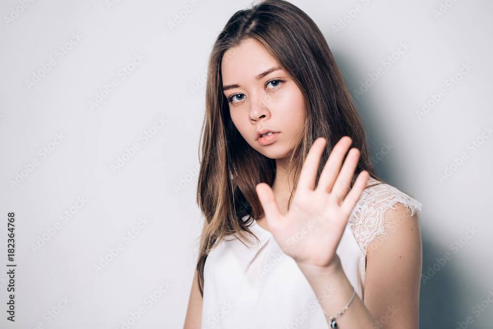 woman showing stop gesture, enough, it is not necessary woman showing stop gesture, enough, it is not necessary