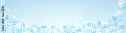 Festive banner Christmas background and winter with copy space. snow and ice crystals on blue sky