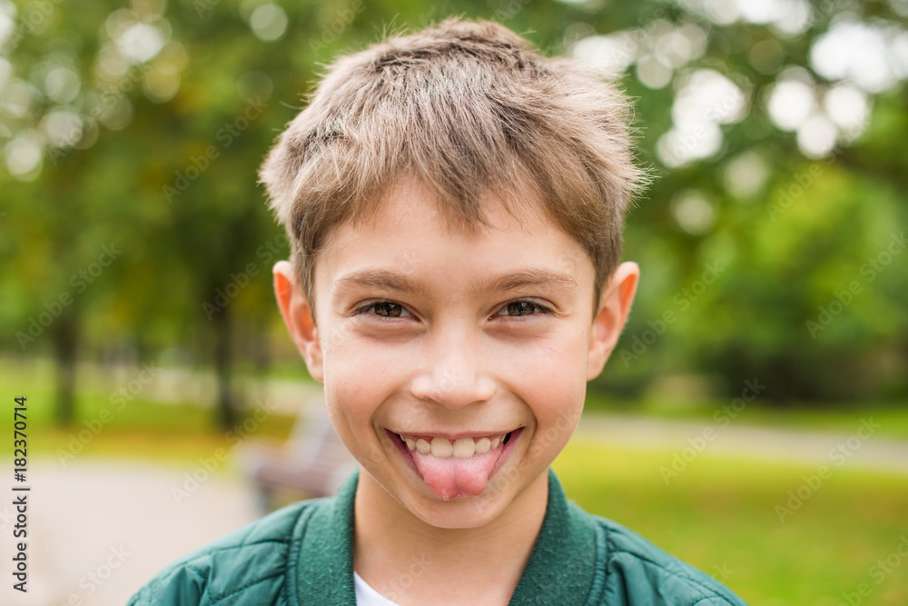Portrait of a boy showing the tongue Portrait of a boy showing the tongue