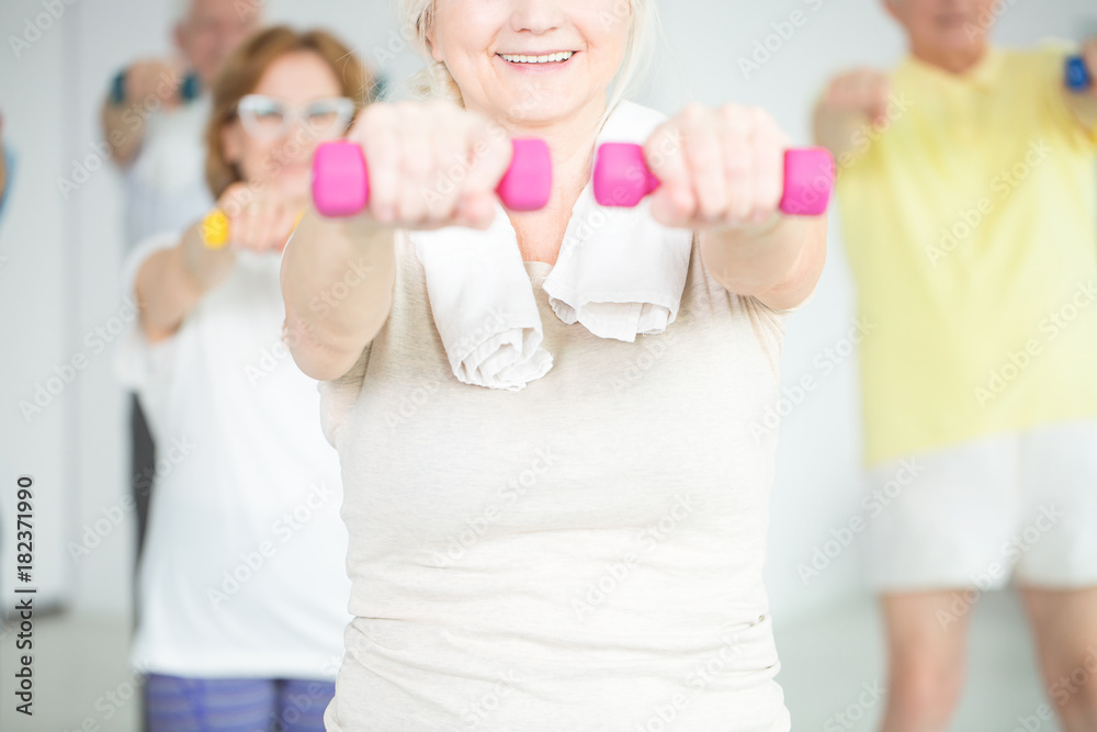 Smiling person working out Smiling person working out