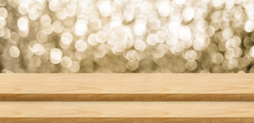 Empty wood step table stand with blur abstract sparkle gold background bokeh light,Mock up for display or montage of product,Banner or header for advertise on online media,Holiday celebrate concept.