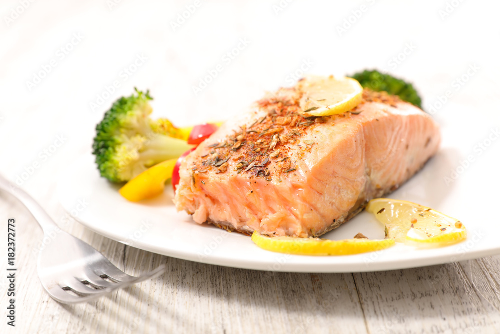 salmon cooked with spices and vegetables salmon cooked with spices and vegetables