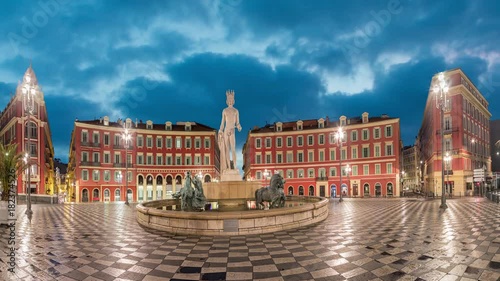 Fontaine du Soleil on Place Massena square at dusk in Nice, Alpes-Maritimes, France (static image with animated sky)
