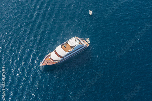 Luxury yacht aerial photograph. Blue sea and soft waves © icemanphotos