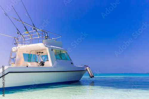 Fishing boat in tropical sea, getting ready to go out