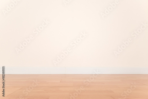 Interior of empty room with parquet floor.