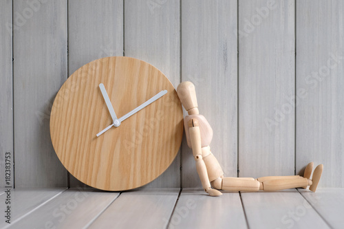 Wood model waiting time with clock, Time concept