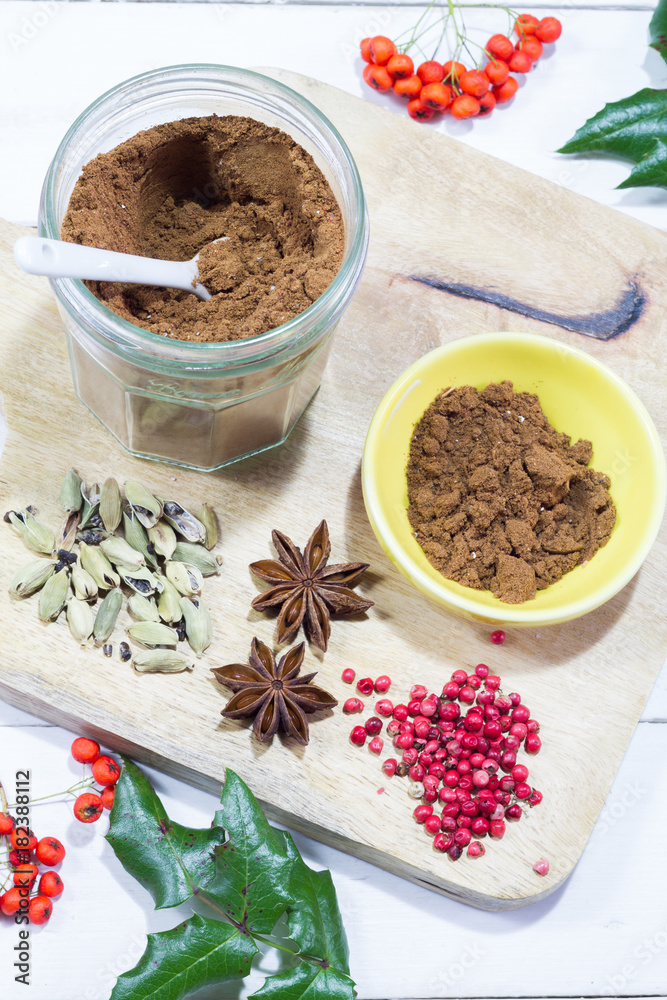 Gingerbread spices in the jar. White, wooden table. Wooden kitchen board. Gingerbread spices in the jar. White, wooden table. Wooden kitchen board.