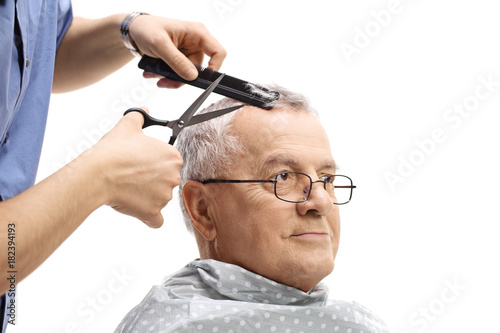 Mature man having a haircut