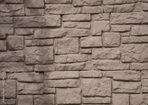 Stone and brick facades of buildings, stone and brick backgrounds and textures for designers
