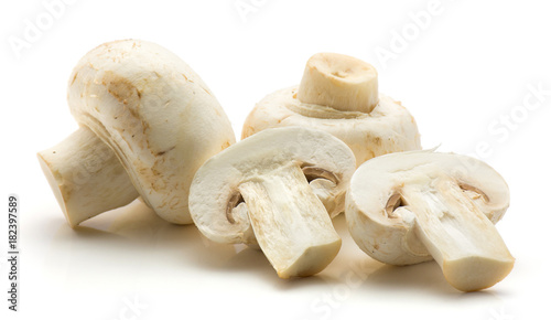 Sliced champignons isolated on white background two whole two halves.